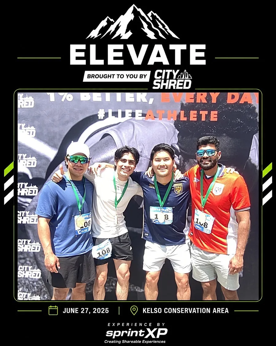 Four friends posing together at a community event